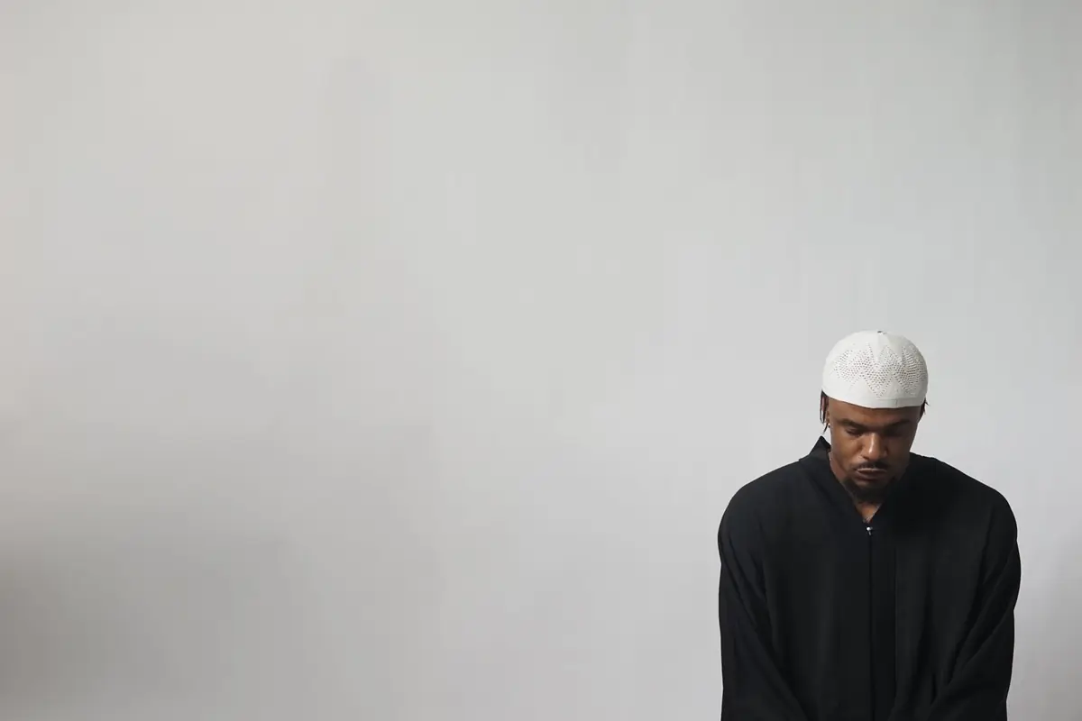 A man in a prayer cap