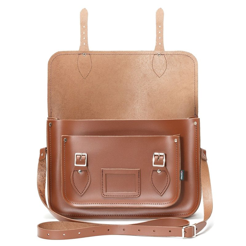Tan leather madrasah satchel with the flap open