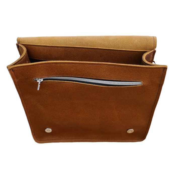 Handmade tan leather madrasah bag (madrasa bag), flap open, showing the inside