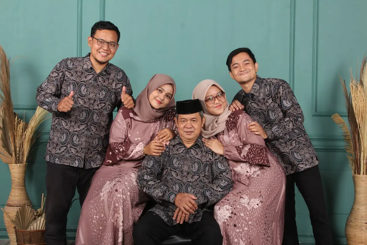 A Malay family in matching batik for a family portrait