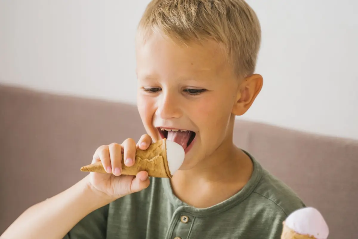 A boy enjoying an ice cream