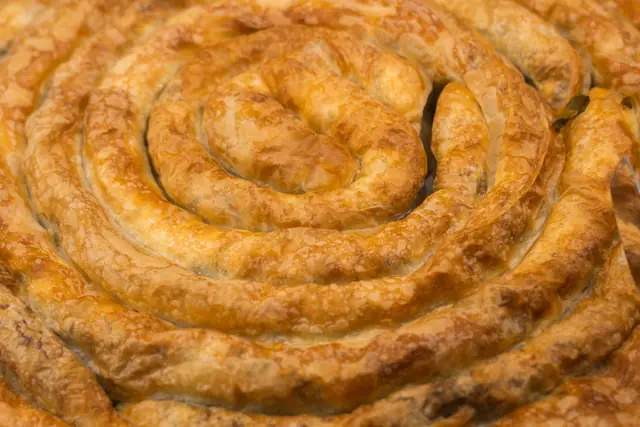 A freshly baked spiral burek pie