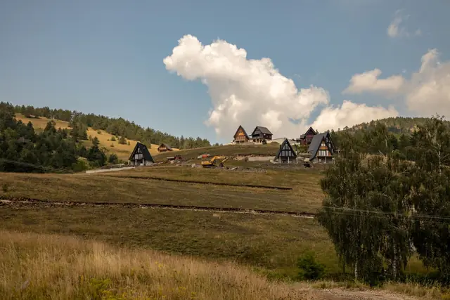Green hills and wooden chalets on the Zlatibor mountain